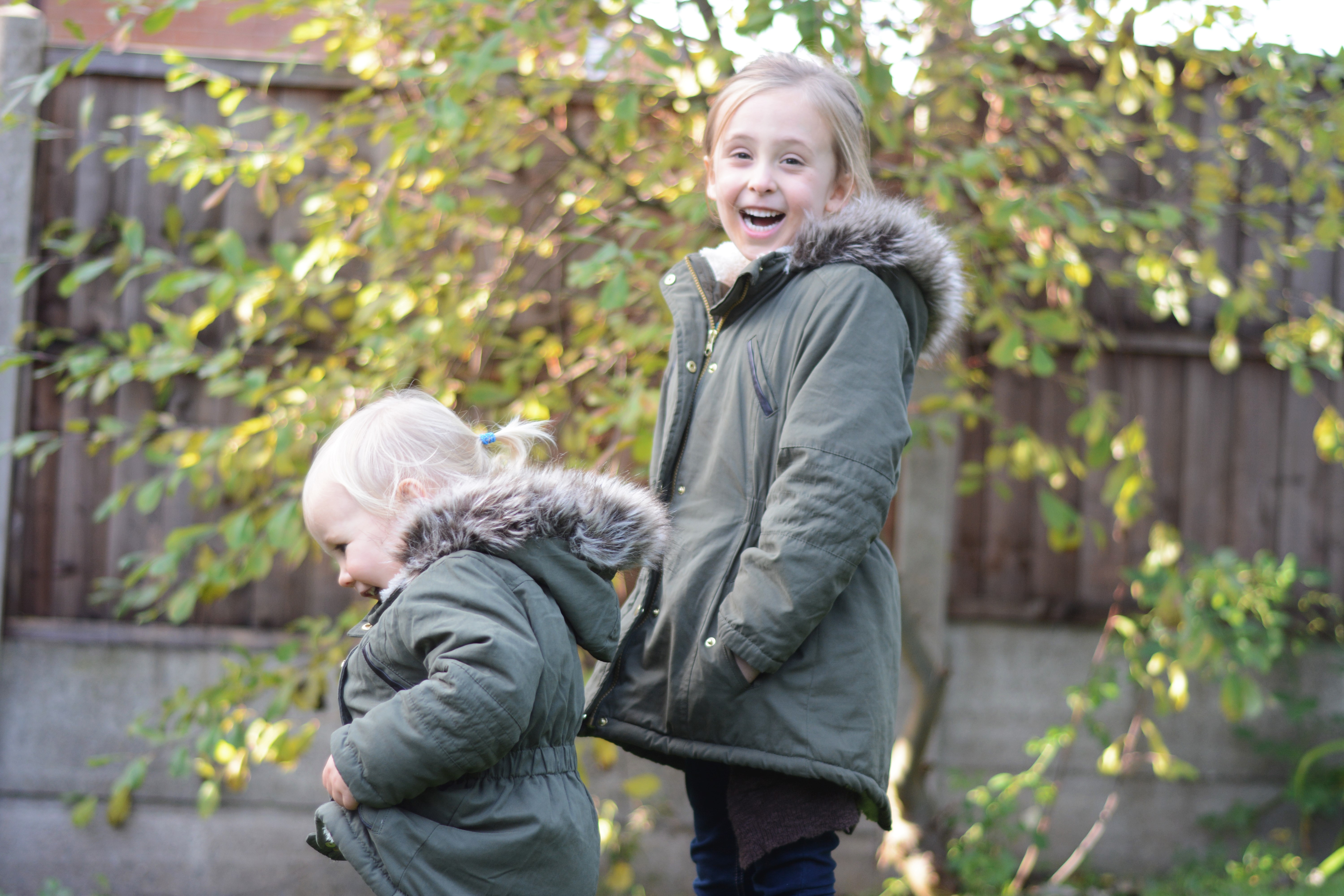 Sisters November in matching coats 